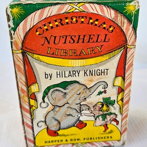 May include: A vintage Christmas Nutshell Library book by Hilary Knight featuring a red and green striped cover with an illustration of an elephant and a girl. The book title is "Christmas Nutshell Library" and the author is "Hilary Knight".