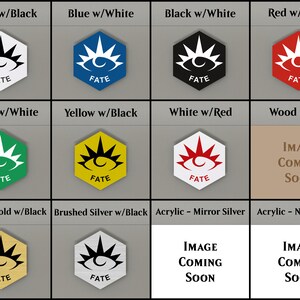 May include: A collection of hexagonal-shaped designs in various color combinations, including white, black, blue, red, green, and yellow. Each design features a stylized eye symbol and the word "FATE". Some options are "Wood - MDF", "Brushed Gold w/Black", and "Brushed Silver w/Black".