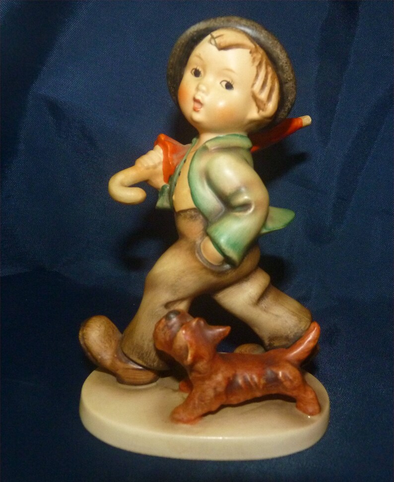 Antique M I Hummel Figurine Strolling Along 1959 TMK3 Current Book Value = 250 dollars.