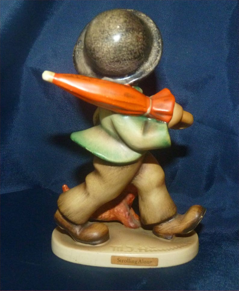 Antique M I Hummel Figurine Strolling Along 1959 TMK3 Current Book Value = 250 dollars.
