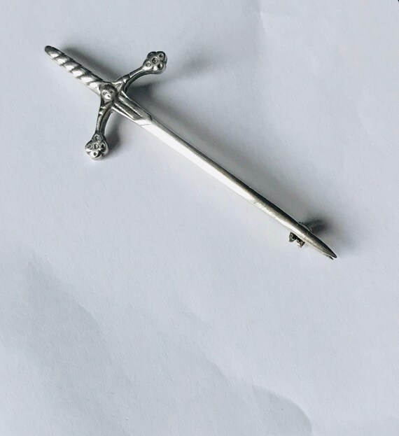 Claymore sword being held