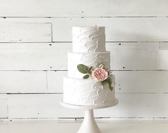 Fake wedding cake.  tall tiers cake.  Display cakes. centerpiece