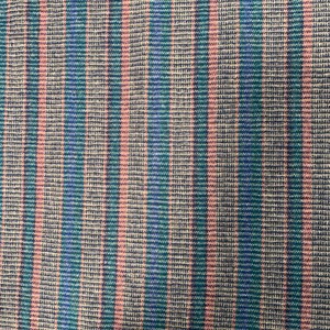 May include: A close-up of a striped fabric with pink, blue, and green stripes. The fabric has a textured woven pattern.