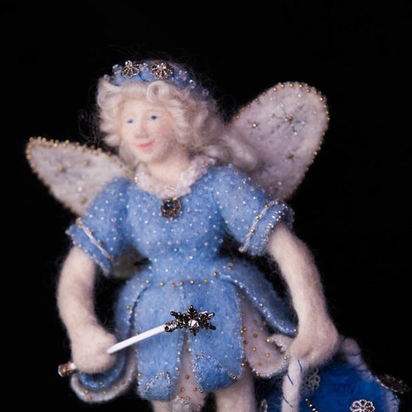 The Snow Fairy is an original needle felted doll.