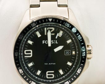 Reloj de pulsera Fossil de acero inoxidable con etiqueta