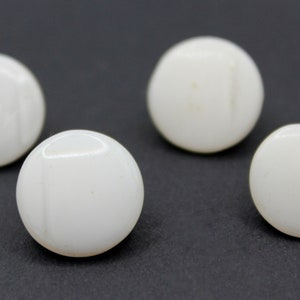 Four Pearly White Shank Buttons
