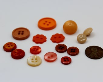 Assortment of 15 orange buttons