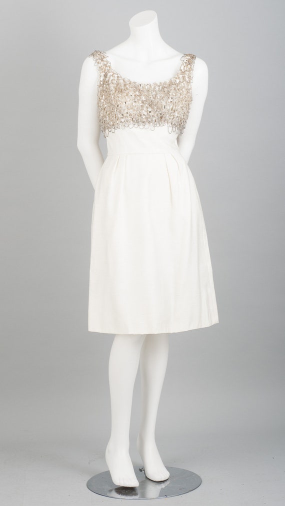 **Portia and Scarlett: Shimmering Cocktail Dress with Cascading Beads and Feathered Hem** main image 1