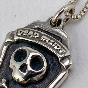 Dead Inside skull + crossbones necklace detail
