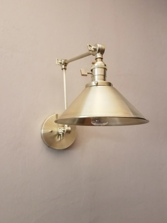 Swing arm outlet vanity light