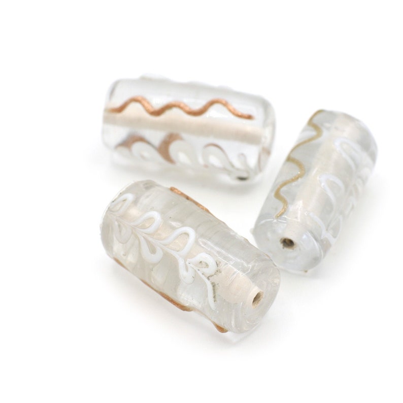 Clear Barrel Shaped Beads with Raised Squiggles and Flowers of White and Gold 20-25mm 2pcs