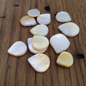 Genuine Mother of Pearl Flat Teardrops Ivory Color Varies in size  10pcs