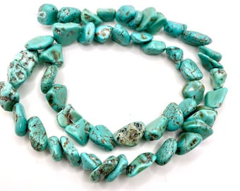 May include: Strand of turquoise gemstone beads. The beads are a vibrant turquoise color with brown matrix patterns. The irregular, polished stones are strung together, creating a natural and earthy aesthetic. Ideal for jewelry making.