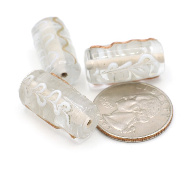 Clear Barrel Shaped Beads with Raised Squiggles and Flowers of White and Gold 20-25mm 2pcs