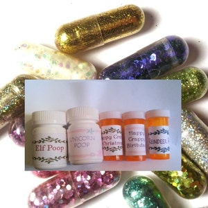 May include: Five small glass bottles with colorful glitter inside. The bottles are labeled with whimsical names like "Elf Poop", "Unicorn Poop", "Happy Christmas", "Happy Birthday", and "Reindeer Food".