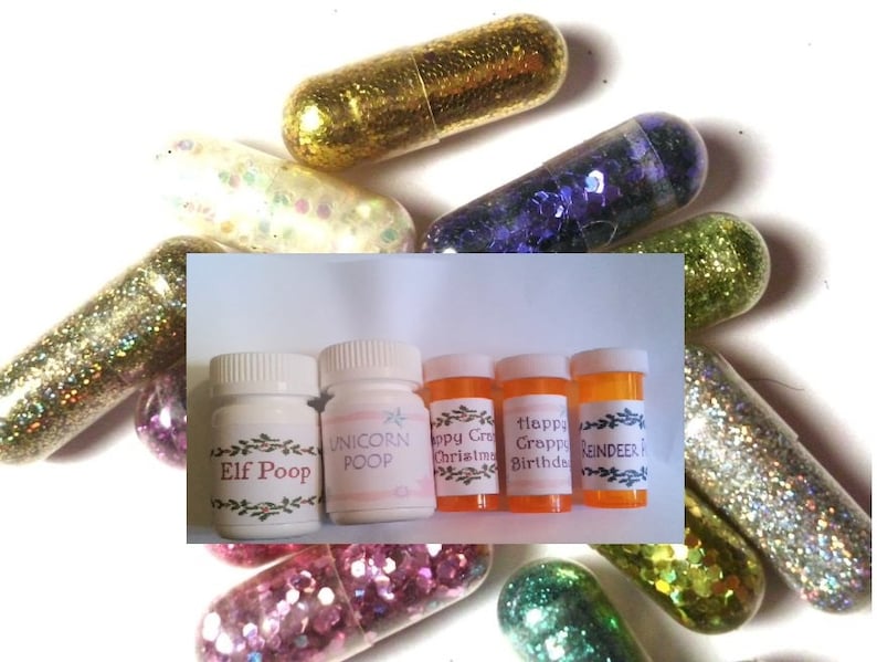 May include: Five small glass bottles with colorful glitter inside. The bottles are labeled with whimsical names like "Elf Poop", "Unicorn Poop", "Happy Christmas", "Happy Birthday", and "Reindeer Food".