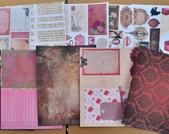 May include: A set of vintage-style scrapbook paper featuring a variety of designs, including floral patterns, damask patterns, and textural backgrounds. The papers are in shades of red, brown, and pink.