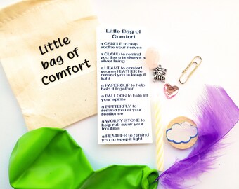 May include: A small burlap bag with the text "Little bag of Comfort" printed on it. The bag contains a variety of small items, including a candle, a cloud, a heart, a feather, a paperclip, a balloon, a butterfly, and a worry stone. The items are meant to provide comfort and support.
