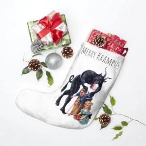 May include: White Christmas stocking with the text "MERRY KRAMPUS" and a vintage illustration of Krampus and children. The stocking is filled with wrapped gifts and pine cones. Additional gifts, pine cones, and a silver ornament are scattered around.