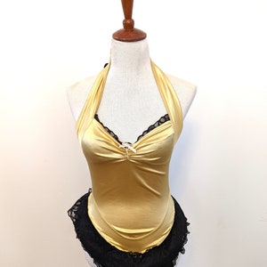 Disfraz de corista vintage de los años 80, disfraz de licra dorada de los años 80, disfraz de burlesque vintage de los años 80. Disfraz de pin-up de encaje negro
