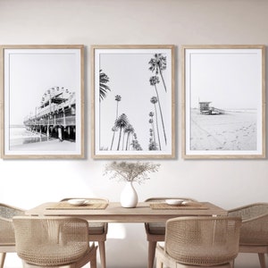 Set of 3 Santa Monica black and white photography prints showing the ferris wheel, palm trees and a lifeguard stand on the beach.