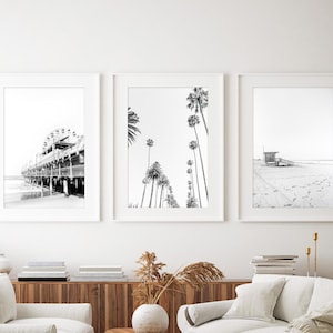 Set of 3 Santa Monica black and white photography prints showing the ferris wheel, palm trees and a lifeguard stand on the beach.