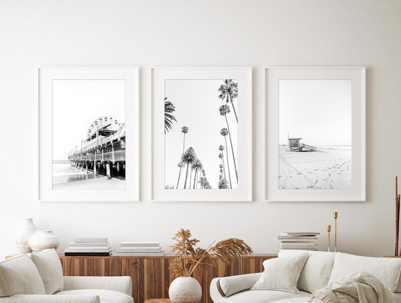 Set of 3 Santa Monica black and white photography prints showing the ferris wheel, palm trees and a lifeguard stand on the beach.