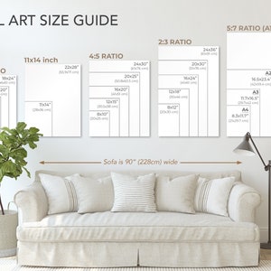 Wall art size guide showing scale of image sizes compared to a 90 inch sofa below.