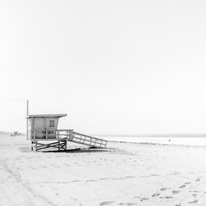 Set of 3 Santa Monica black and white photography prints showing the ferris wheel, palm trees and a lifeguard stand on the beach.