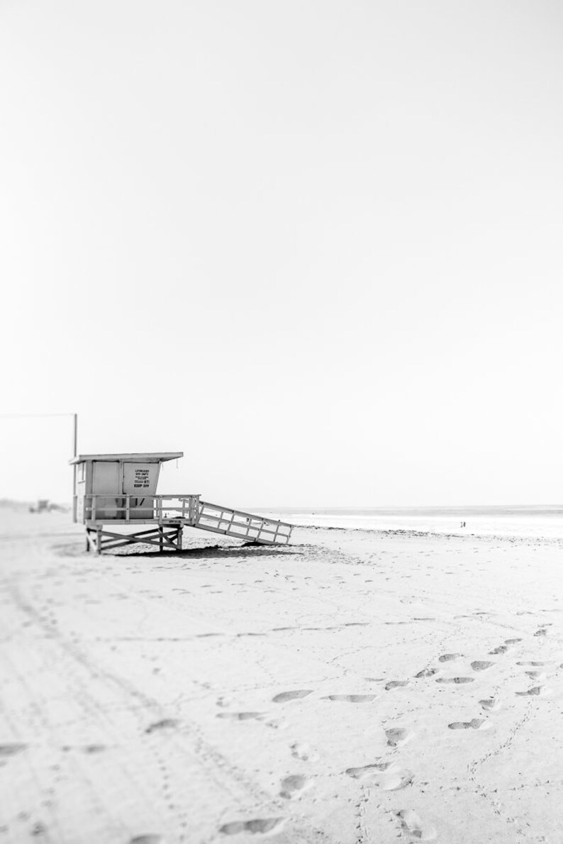 Set of 3 Santa Monica black and white photography prints showing the ferris wheel, palm trees and a lifeguard stand on the beach.
