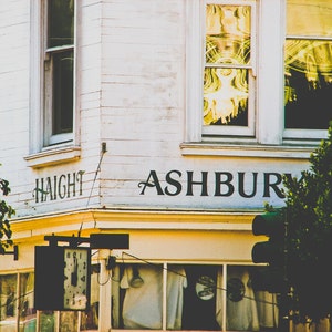 San Francisco photography print showing the Haight Ashbury district. Words are written on building at intersection.  Colors are white yellow and black.