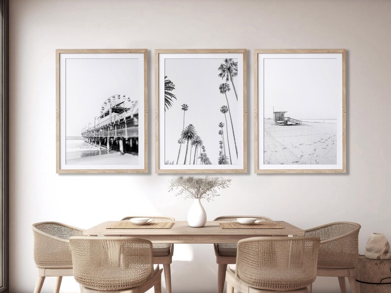 Set of 3 Santa Monica black and white photography prints showing the ferris wheel, palm trees and a lifeguard stand on the beach.