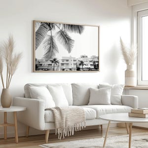 South Beach photography print showing 3 Art Deco hotels framed under a palm tree on the top left.  Black and white version.