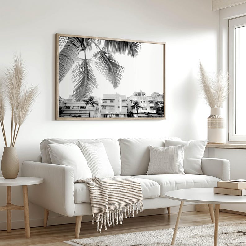 South Beach photography print showing 3 Art Deco hotels framed under a palm tree on the top left.  Black and white version.