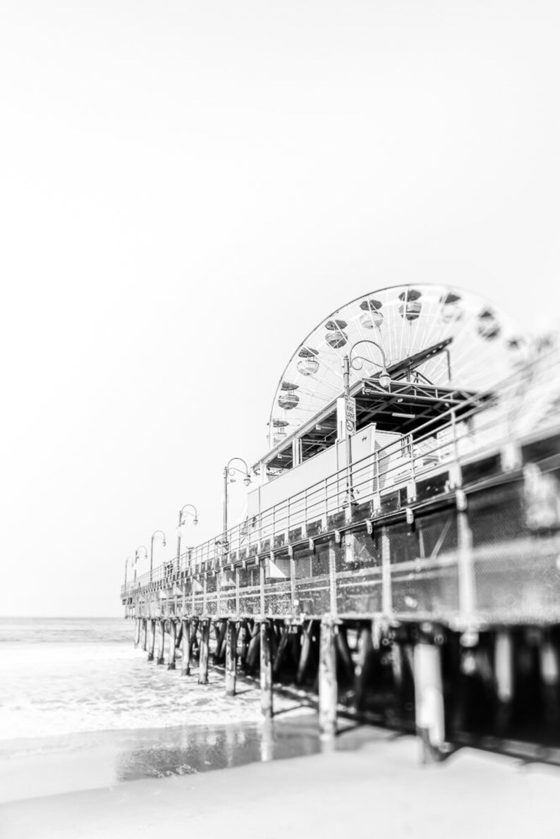 Set of 3 Santa Monica black and white photography prints showing the ferris wheel, palm trees and a lifeguard stand on the beach.