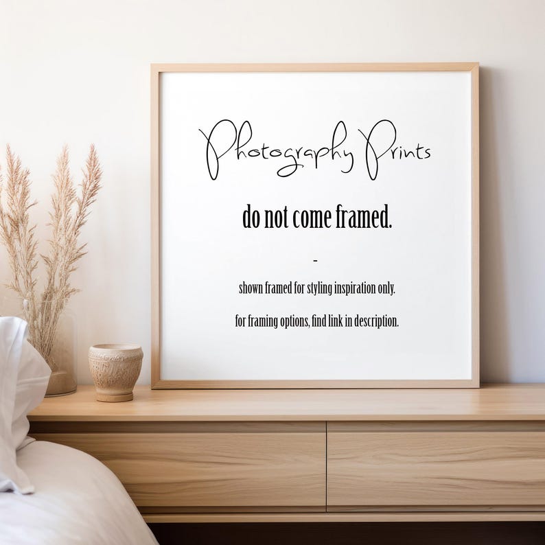 May include: A framed print with the text "Photography Prints" in a cursive font. The text "do not come framed" is below. Additional text states the print is for styling inspiration only and to find framing options in the description.