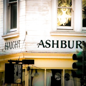 San Francisco photography print showing the Haight Ashbury district. Words are written on building at intersection.  Colors are white yellow and black.