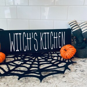 Witch's Kitchen wood shelf sitter