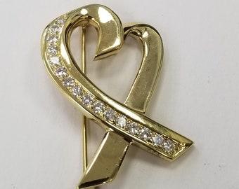 Broche con forma de corazón y diamantes de Paloma Picasso Valent en oro de 18 quilates de Tiffany & Co.