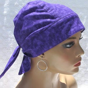 Purple scrub cap, chemo hat, cancer hair loss hat with a cotton terry cloth sweatband.  Handmade in the United States of America.