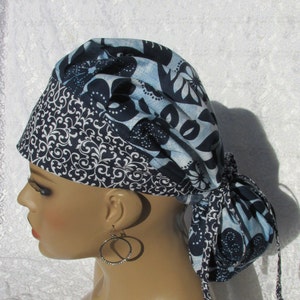 Blue floral bouffant ponytail scrub hat with a cotton terry cloth sweat band.  Handmade in the USA.