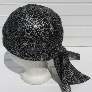 Spider web skull cap, doo rag, bandana hat, cancer hair loss hat, chef hat with a cotton terry cloth sweatband.  Handmade in America.