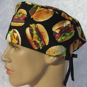 May include: Black scrub hat with a repeating pattern of colorful cheeseburgers.