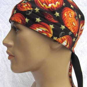 Pumpkin Halloween skull cap, chemo hair loss cap, bandana hat with a cotton terry cloth sweatband.  Handmade in America.