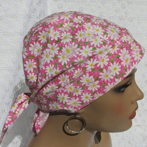 Women&#39;s pink daisy chemo hair loss bandana hat with a cotton terry cloth sweatband.  Handmade in the United States of America.