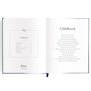 May include: A book titled "Fox Falla" with a blue cover and a table of contents for a journal about childhood memories. The page is open to the section titled "Childhood" with questions about where and when the reader was born, their name, and early memories.