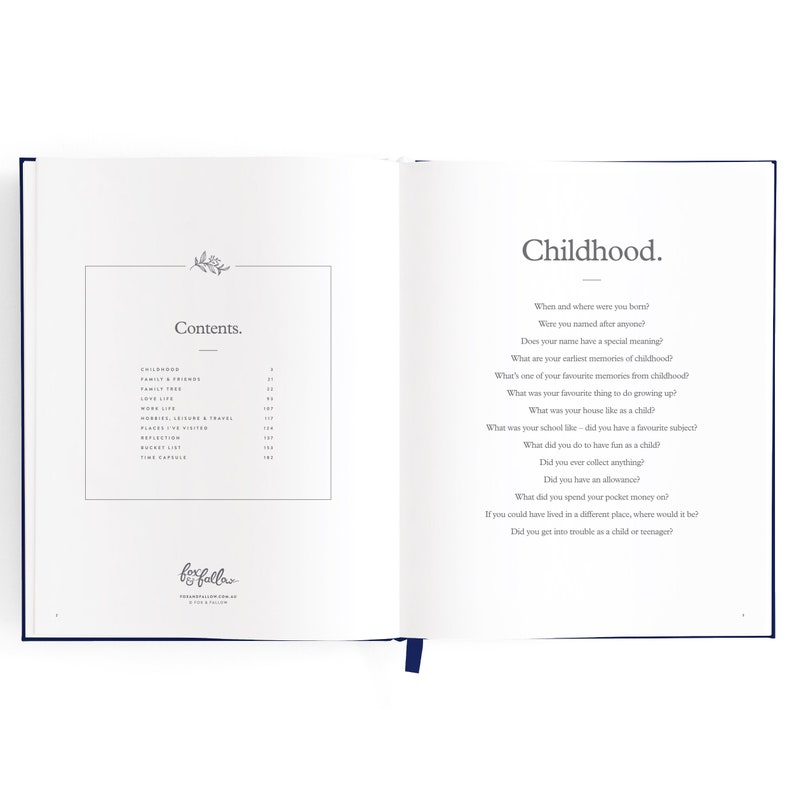 May include: A book titled "Fox Falla" with a blue cover and a table of contents for a journal about childhood memories. The page is open to the section titled "Childhood" with questions about where and when the reader was born, their name, and early memories.
