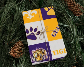 May include: Purple and gold wrapping paper with a tiger, paw prints, fleur-de-lis, and the text "Geaux Tigers".