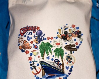 May include: White canvas tote bag with a blue and white Mickey Mouse design featuring a cruise ship, palm trees, an octopus, and the text "Castaway Cay".