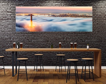 Panoramic Print of a Beautiful Sunrise over the Golden Gate Bridge with the Bay Area covered in Fog and the San Francisco Skyline lit up